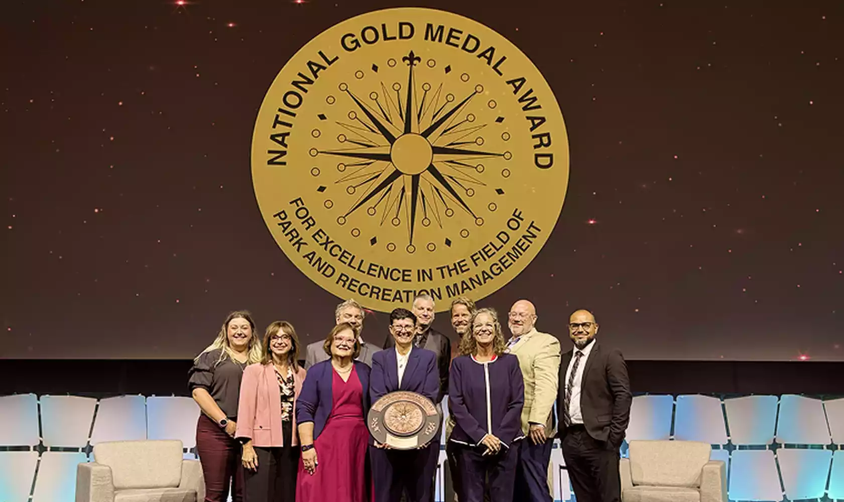Park District of Oak Park team on stage receiving the National Gold Medal Award