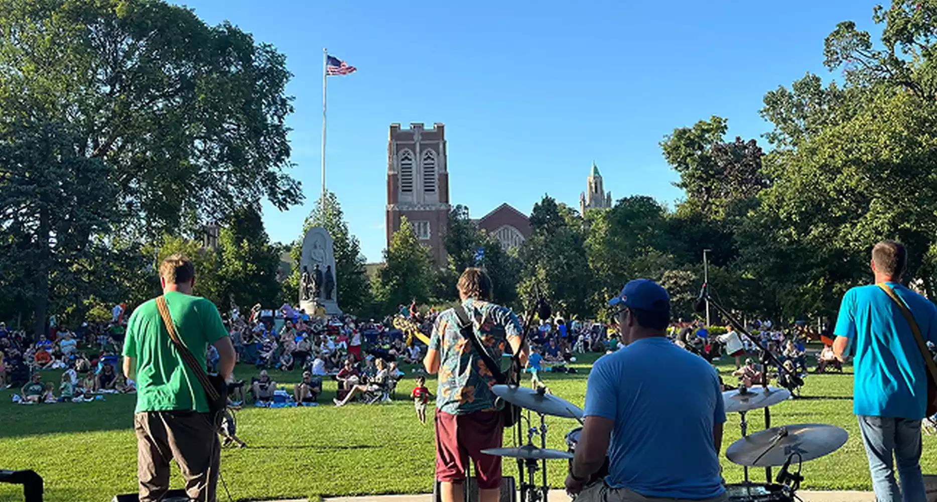 People attending a live music event in a park