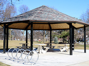 Octagonal gazebo with picnic tables and bike racks in Maple Park.