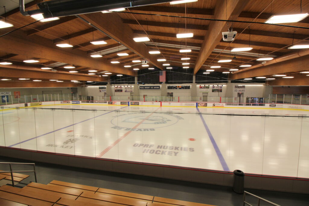 Paul Hruby Ice Arena features an ice rink with "OPRF HUSKIES HOCKEY" visible on the ice.