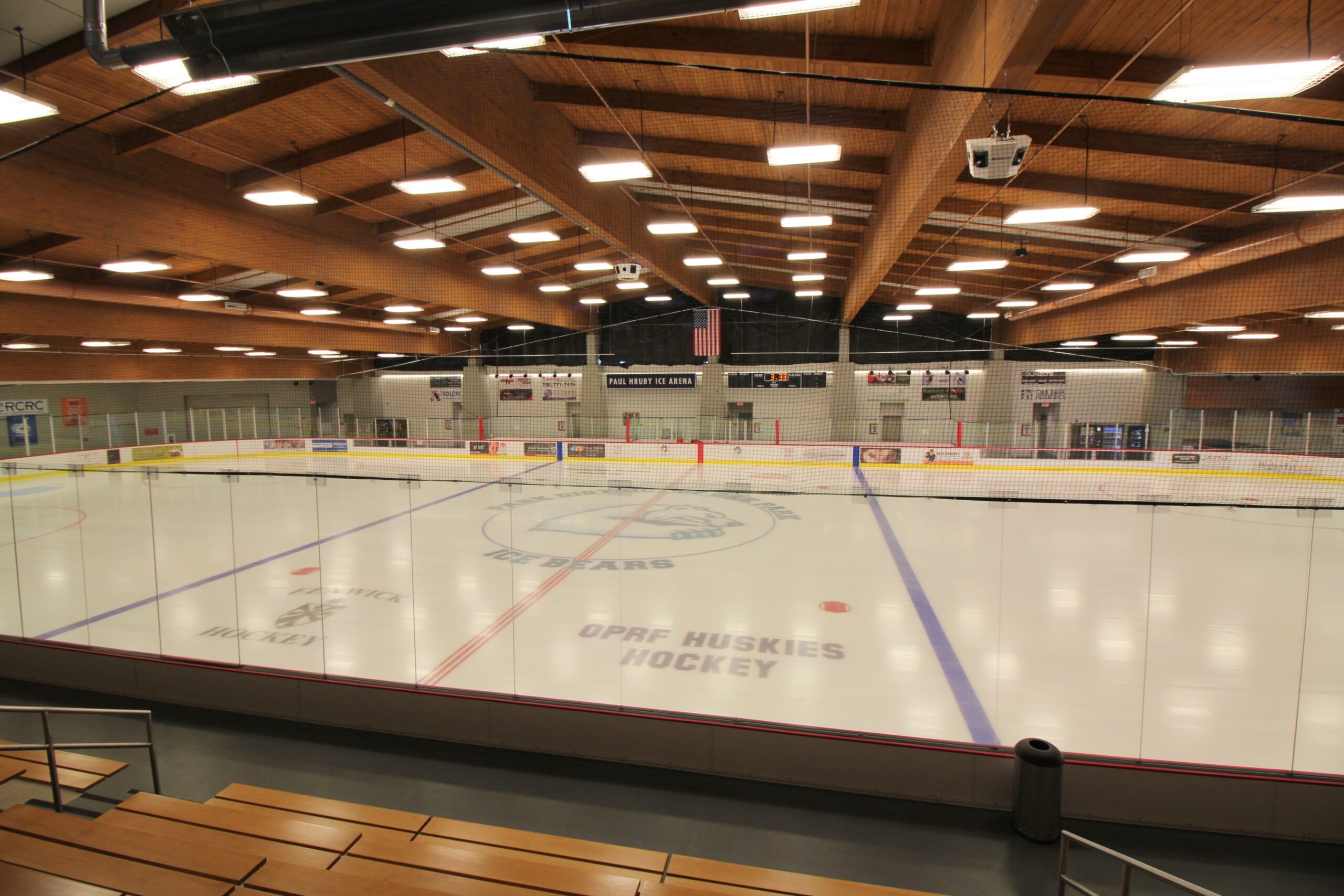 Paul Hruby Ice Arena features an ice rink with "OPRF HUSKIES HOCKEY" visible on the ice.