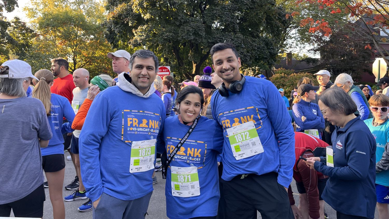 three runners wearing blue frank lloyd wright races tshirts