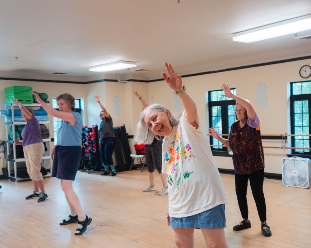 a group of lifelong learners participate in a fitness class