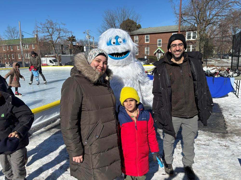 a family poses for a photo with the abominable snowman